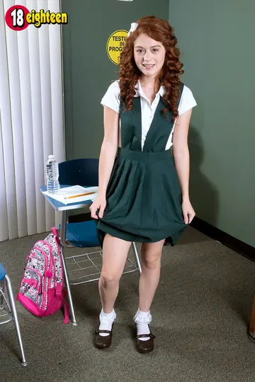 Redhead Strips Out of Her Uniform Skirt and Lingerie