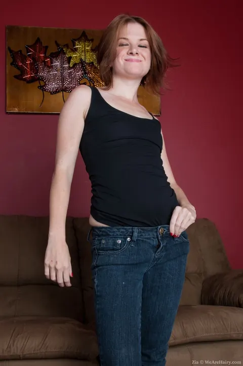 Redhead in Boots Drops Her Jeans and Spreads Her Hairy Pussy – photo 4 of 16
