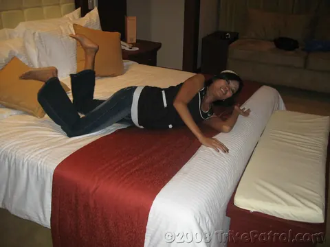 Asian Brunette Strips Out of Her Jeans on the Bed – photo 5 of 21