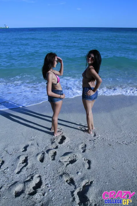Janice Griffith: Two Petite Latinas Lick and Finger Each Other Oiled on the Beach – photo 1 of 21