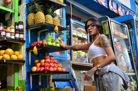 Marly Romero: Tattooed Latina in Glasses Eats a Banana Outdoors – photo 3 of 15
