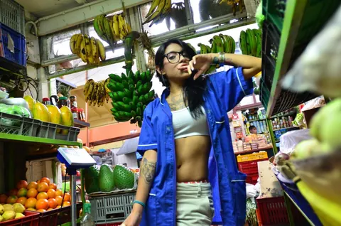 Marly Romero: Tattooed Latina in Glasses Eats a Banana Outdoors – photo 12 of 15