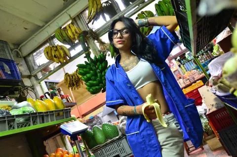 Marly Romero: Tattooed Latina in Glasses Eats a Banana Outdoors – photo 11 of 15