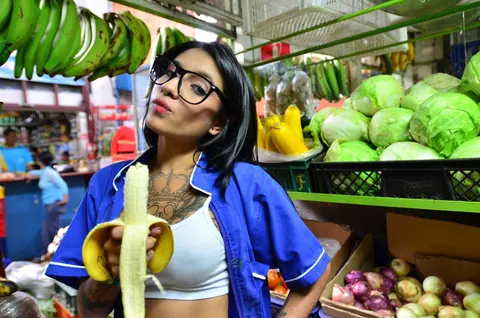 Marly Romero: Tattooed Latina in Glasses Eats a Banana Outdoors – photo 9 of 15