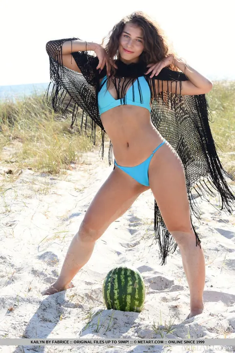 Brunette Strips Off Her Bikini and Spreads Her Shaved Pussy on the Beach – photo 5 of 18