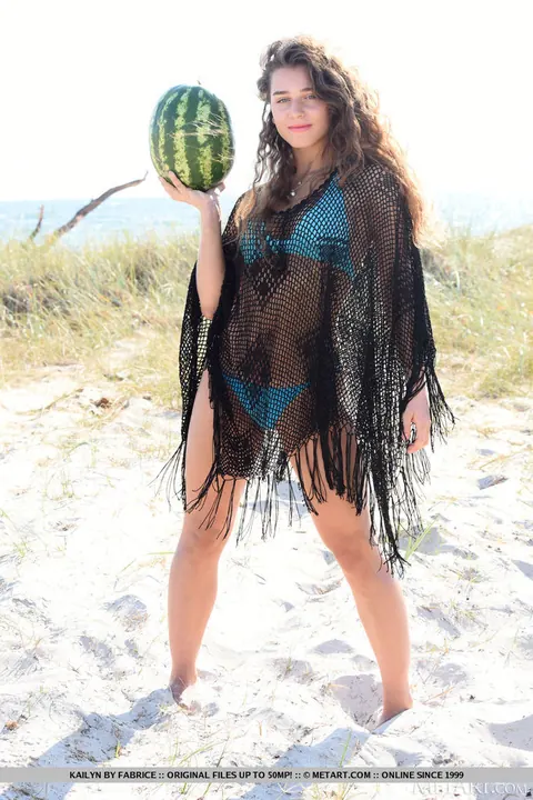 Brunette Strips Off Her Bikini and Spreads Her Shaved Pussy on the Beach – photo 1 of 18