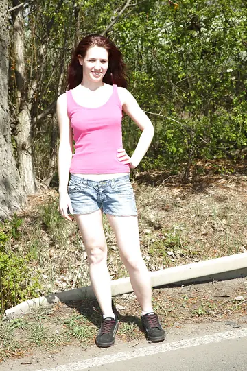 Busty Brunette Sheds Her Shorts Outdoors and Fingers Her Slit