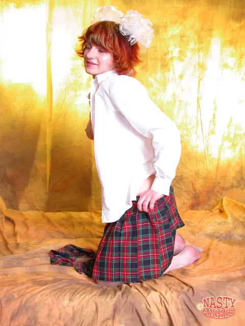 Redhead Strips Off Her Uniform Skirt and Rides a Blue Dildo – photo 9 of 21