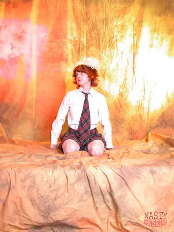 Redhead Strips Off Her Uniform Skirt and Rides a Blue Dildo
