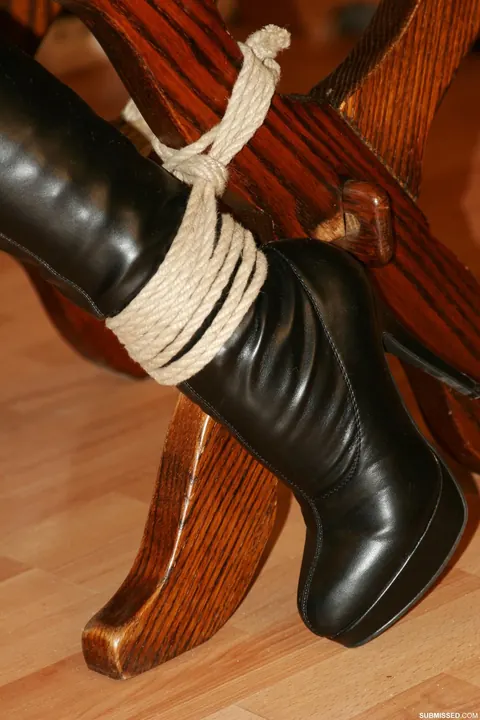 Brunette in Jeans and Heels Tests Restraints While Tied to a Chair – photo 16 of 20