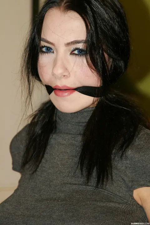 Brunette in Jeans and Heels Tests Restraints While Tied to a Chair – photo 10 of 20