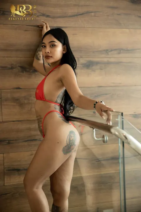 Thick Asian Babe Strips Nude and Flaunts Her Big Ass and Tattoos – photo 7 of 14