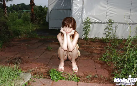 An Nanba: Japanese Brunette in a Skirt Strips and Spreads Outdoors – photo 8 of 14