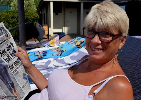 Tall Blonde MILF with Big Tits Sunbathes Topless in the Garden – photo 3 of 16