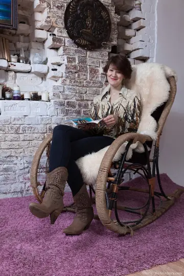 Busty Slim Redhead with Short Hair Fingers Her Hairy Pussy in the Chair