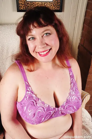 Mature Curvy Brunette Strips Off Her Pink Panties and Spreads Her Pussy