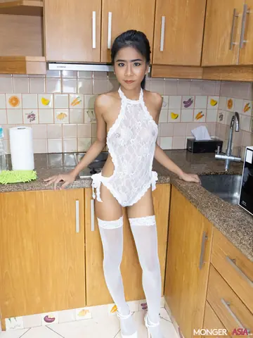 Thai Woman in Stockings Spreads Her Shaved Pussy