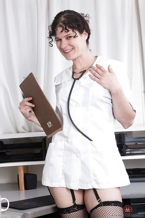 Thick Mature Brunette Sheds Her Doctor Uniform Outdoors in Stockings – photo 1 of 16