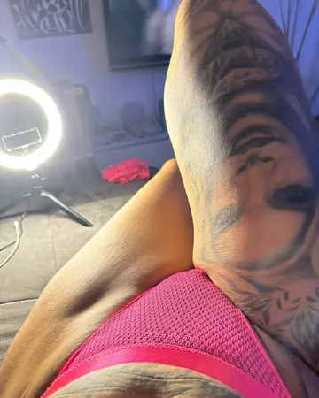 Tattooed Amateur Strips Nude and Poses for the Camera