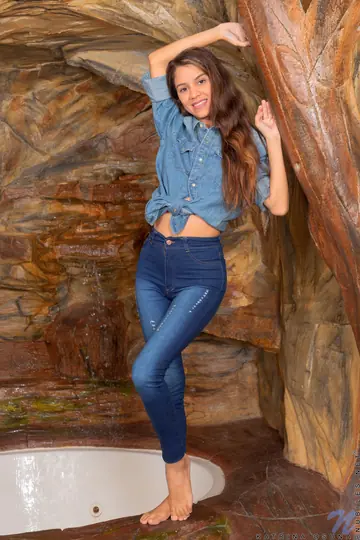 Skinny Latina in Jeans Pulls Panties Aside to Show Tattoo
