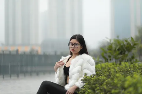 Asian Brunette in Glasses Poses Outdoors in Her Clothes – photo 17 of 21