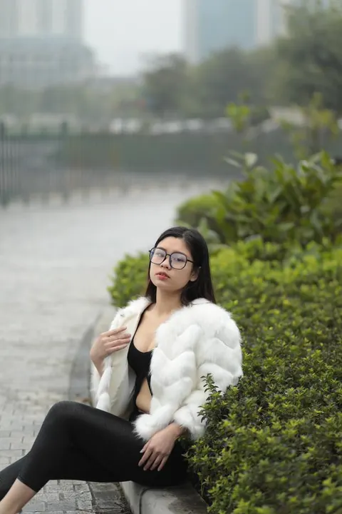 Asian Brunette in Glasses Poses Outdoors in Her Clothes – photo 16 of 21