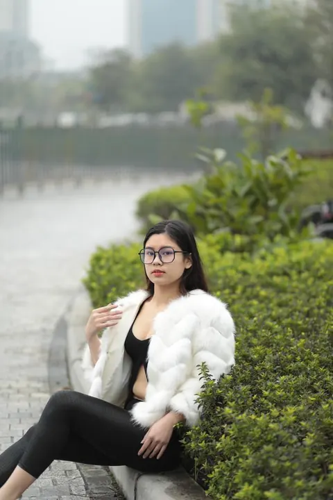 Asian Brunette in Glasses Poses Outdoors in Her Clothes – photo 15 of 21