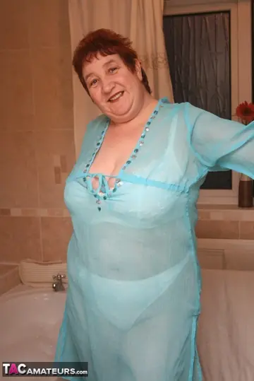 Busty Redhead in Panties and Heels Spreads in the Bathroom