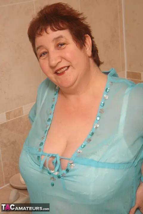 Kinky Carol: Busty Redhead in Panties and Heels Spreads in the Bathroom – photo 11 of 20