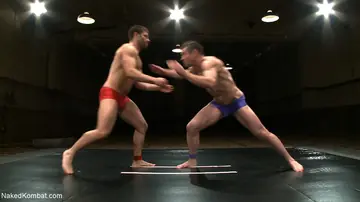 Two Naked Men Grapple in a Wrestling Match