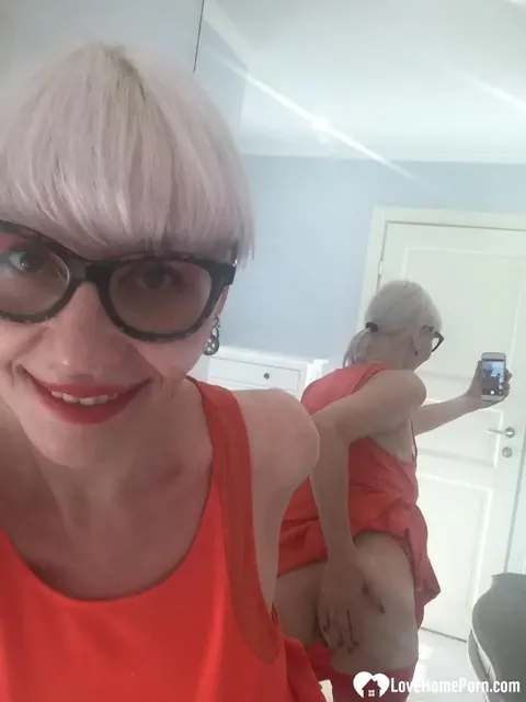 Blonde MILF Strips and Flashes Her Big Tits in the Mirror – photo 16 of 18