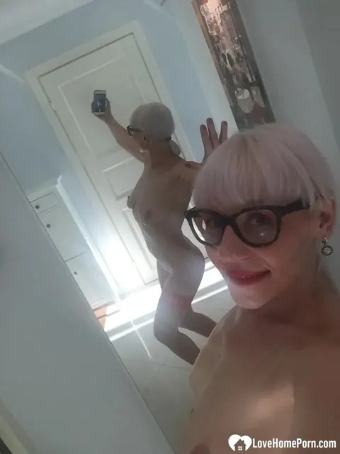 Blonde MILF Strips and Flashes Her Big Tits in the Mirror – photo 18 of 18