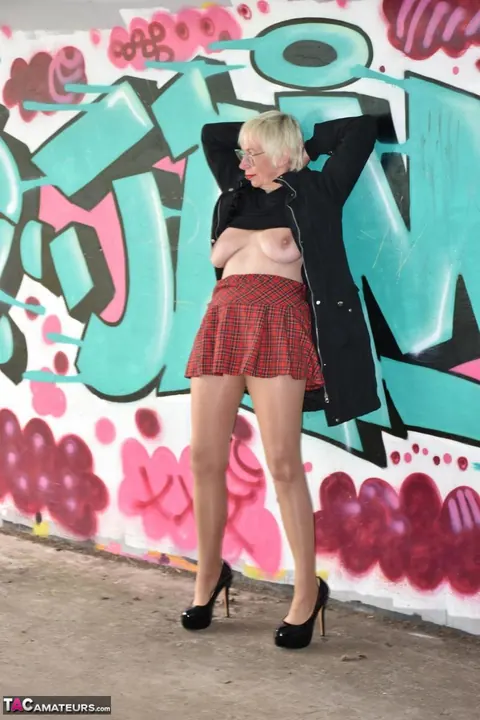 Mature Blonde in a Skirt and Heels Spreads Outdoors – photo 7 of 16