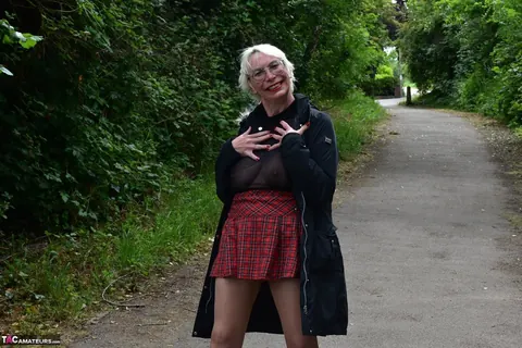 Mature Blonde in a Skirt and Heels Spreads Outdoors – photo 2 of 16