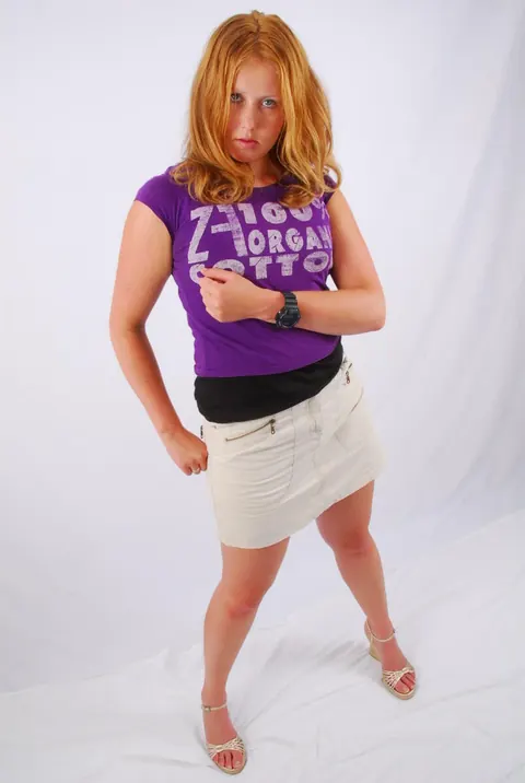 Redhead Spreads Her Legs in a Skirt and High Heels – photo 15 of 16