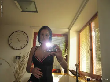 Jessalyn – Redhead with Short Hair Undresses and Spreads Before Mirror