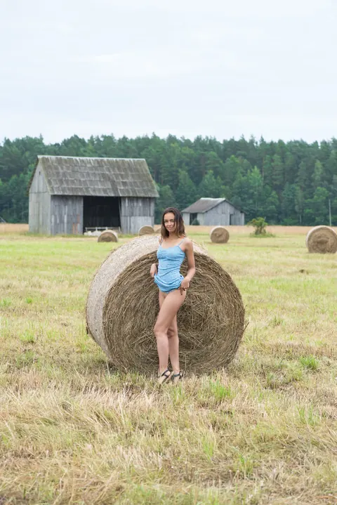Slava: Brunette Strips Out of Her Dress on Hay in a Forest – photo 3 of 20