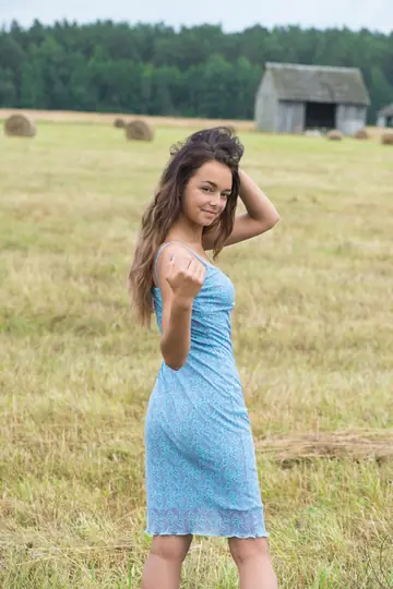 Slava – Brunette Strips Out of Her Dress on Hay in a Forest