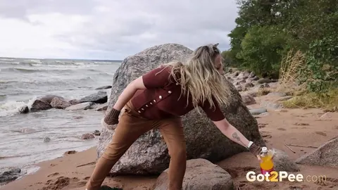 Katy Dee: European Blonde Leans Back on a Boulder to Piss on the Beach – photo 3 of 15