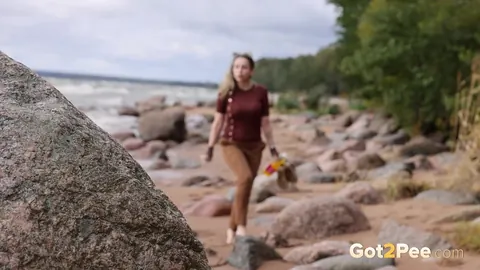 Katy Dee: European Blonde Leans Back on a Boulder to Piss on the Beach – photo 2 of 15