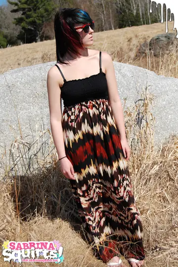 Brunette Strips Out of Her Dress and Lingerie on the Forest Boulder