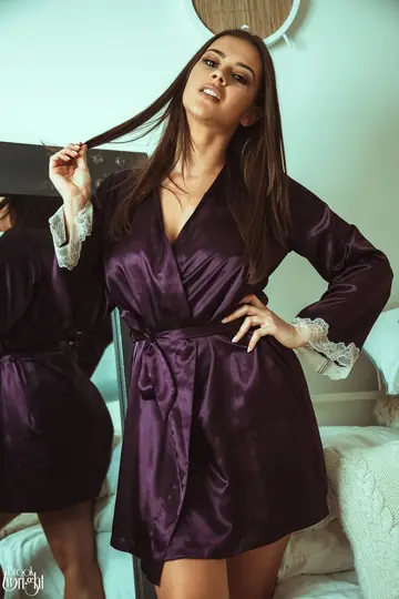 British Brunette Removes Her Robe and Skirt in the Bedroom
