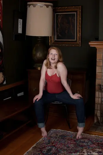 Thick Redhead Pulls Down Her Jeans and Shows Her Hairy Pussy