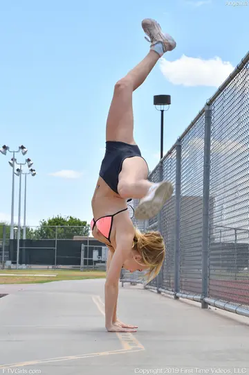 Hanna Hawthorne – Slim Blonde in a Bikini and Shorts Flashes Outdoors at the Gym