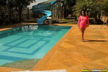PAWG Brunette in High Heels Gets Oiled and Fingers Herself by the Pool