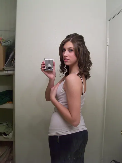 Tiffany Thompson: Curly Brunette in Yoga Pants Poses for Mirror Selfies – photo 2 of 20