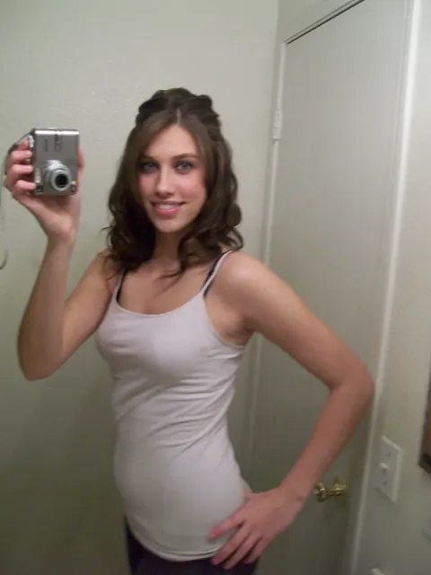 Tiffany Thompson: Curly Brunette in Yoga Pants Poses for Mirror Selfies – photo 3 of 20