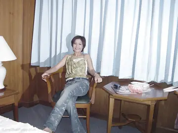 Thai Woman Strips and Uses a Dildo on the Bed