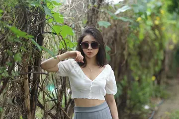 Woman Undresses and Turns to Display Her Figure
