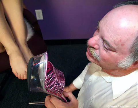 Redhead in High Heels and Skirt Dominates Older Man with Her Feet – photo 4 of 15